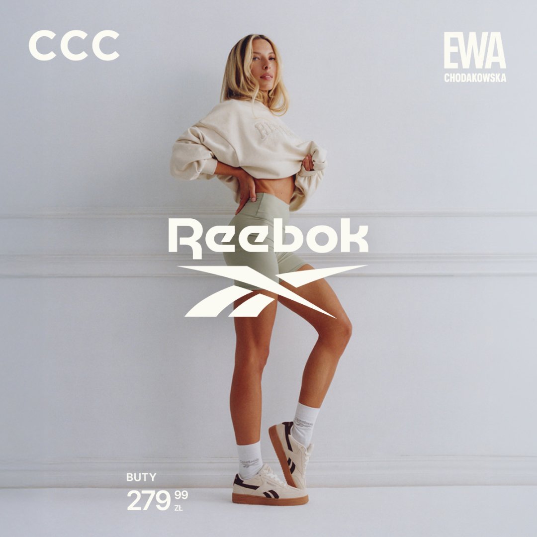 Kobieta w beżowych butach Reebok i sportowym stroju.