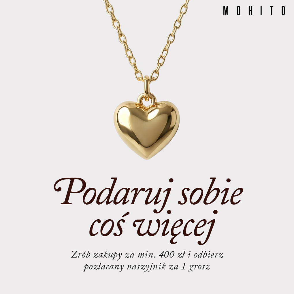 Złoty naszyjnik z sercem na białym tle